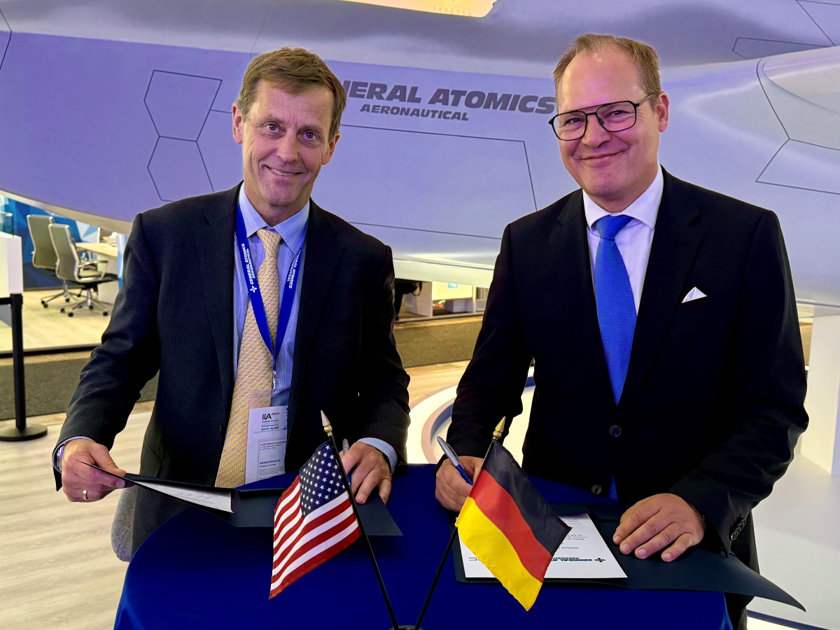 GA-ASI CEO Linden Blue (left) and INTEC Group CEO Christoph Otten sign an MOU during ILA Berlin.
